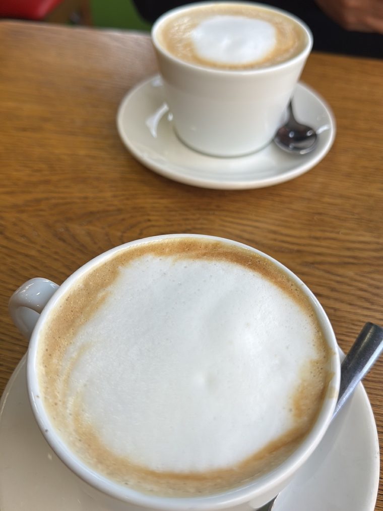 Two white coffees on saucers